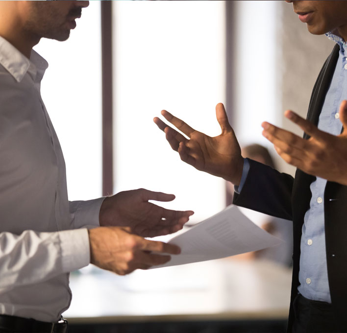 two people at work having a conversation